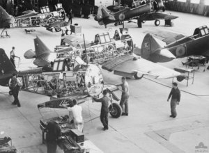 Workers move a Wirraway along the assembly line in 1940